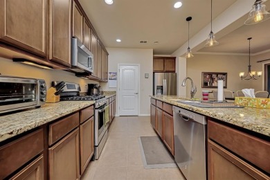 This beautifully maintained corner lot half duplex home is on Wildhorse Golf Club of Robson Ranch in Texas - for sale on GolfHomes.com, golf home, golf lot