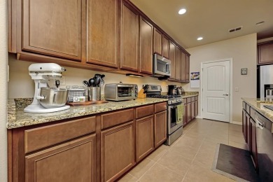 This beautifully maintained corner lot half duplex home is on Wildhorse Golf Club of Robson Ranch in Texas - for sale on GolfHomes.com, golf home, golf lot