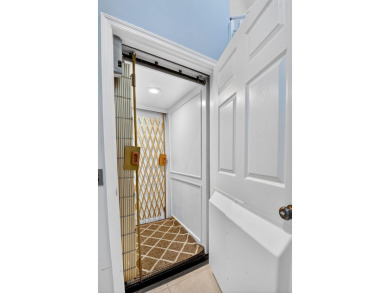 RARELY AVAILABLE 2nd floor coach home with interior elevator on  in Florida - for sale on GolfHomes.com, golf home, golf lot