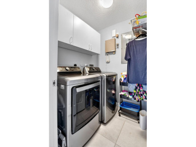 RARELY AVAILABLE 2nd floor coach home with interior elevator on  in Florida - for sale on GolfHomes.com, golf home, golf lot