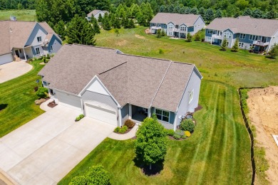 Enjoy easy living just steps from Angels Crossing Golf Course in on Angels Crossing Golf Club in Michigan - for sale on GolfHomes.com, golf home, golf lot