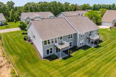 Enjoy easy living just steps from Angels Crossing Golf Course in on Angels Crossing Golf Club in Michigan - for sale on GolfHomes.com, golf home, golf lot