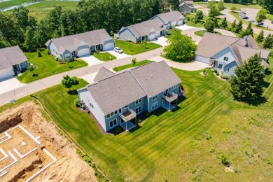 Enjoy easy living just steps from Angels Crossing Golf Course in on Angels Crossing Golf Club in Michigan - for sale on GolfHomes.com, golf home, golf lot