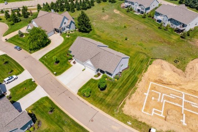 Enjoy easy living just steps from Angels Crossing Golf Course in on Angels Crossing Golf Club in Michigan - for sale on GolfHomes.com, golf home, golf lot