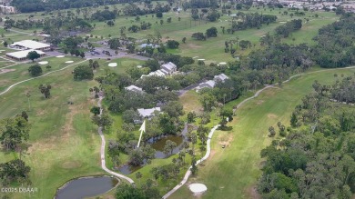 Step out your door with your golf clubs in hand!  The perfect on Daytona Beach Golf Club in Florida - for sale on GolfHomes.com, golf home, golf lot