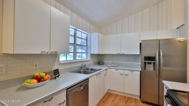Step out your door with your golf clubs in hand!  The perfect on Daytona Beach Golf Club in Florida - for sale on GolfHomes.com, golf home, golf lot