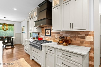 All brick custom home built in 2024 offers easy living one-level on Tellico Village -The Links At Kahite Golf Course in Tennessee - for sale on GolfHomes.com, golf home, golf lot