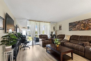 Beautifully updated top floor condo in the 55+ community of Palm on Oriole Golf and Tennis Club in Florida - for sale on GolfHomes.com, golf home, golf lot