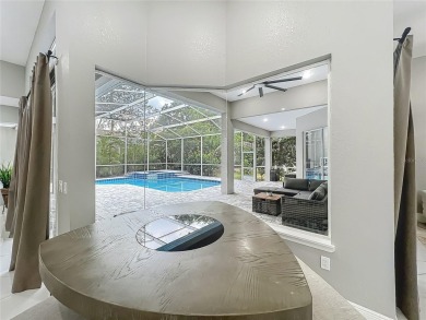 Welcome to a masterpiece of modern design and refined living in on Tuscawilla Country Club in Florida - for sale on GolfHomes.com, golf home, golf lot