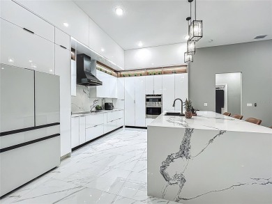 Welcome to a masterpiece of modern design and refined living in on Tuscawilla Country Club in Florida - for sale on GolfHomes.com, golf home, golf lot