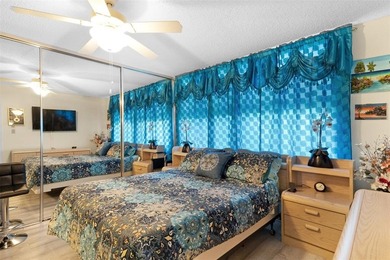 Beautifully updated top floor condo in the 55+ community of Palm on Oriole Golf and Tennis Club in Florida - for sale on GolfHomes.com, golf home, golf lot