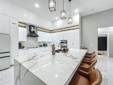 Welcome to a masterpiece of modern design and refined living in on Tuscawilla Country Club in Florida - for sale on GolfHomes.com, golf home, golf lot