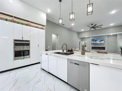 Welcome to a masterpiece of modern design and refined living in on Tuscawilla Country Club in Florida - for sale on GolfHomes.com, golf home, golf lot