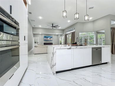 Welcome to a masterpiece of modern design and refined living in on Tuscawilla Country Club in Florida - for sale on GolfHomes.com, golf home, golf lot