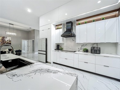 Welcome to a masterpiece of modern design and refined living in on Tuscawilla Country Club in Florida - for sale on GolfHomes.com, golf home, golf lot