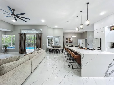 Welcome to a masterpiece of modern design and refined living in on Tuscawilla Country Club in Florida - for sale on GolfHomes.com, golf home, golf lot