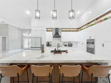 Welcome to a masterpiece of modern design and refined living in on Tuscawilla Country Club in Florida - for sale on GolfHomes.com, golf home, golf lot