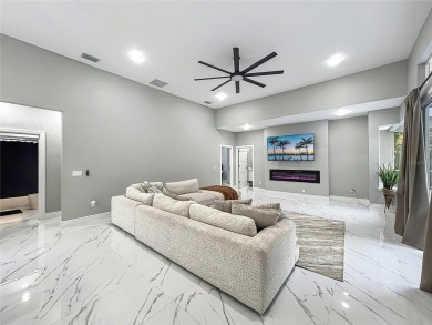 Welcome to a masterpiece of modern design and refined living in on Tuscawilla Country Club in Florida - for sale on GolfHomes.com, golf home, golf lot