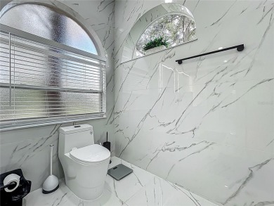 Welcome to a masterpiece of modern design and refined living in on Tuscawilla Country Club in Florida - for sale on GolfHomes.com, golf home, golf lot