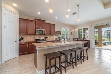 Stunning Golf & Lake Views | Oversized Saltwater Pool | on Herons Glen Golf and Country Club in Florida - for sale on GolfHomes.com, golf home, golf lot