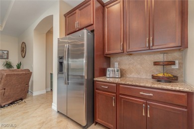 Stunning Golf & Lake Views | Oversized Saltwater Pool | on Herons Glen Golf and Country Club in Florida - for sale on GolfHomes.com, golf home, golf lot