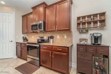 Stunning Golf & Lake Views | Oversized Saltwater Pool | on Herons Glen Golf and Country Club in Florida - for sale on GolfHomes.com, golf home, golf lot
