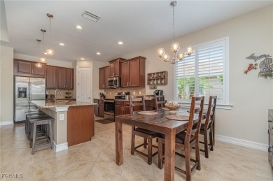 Stunning Golf & Lake Views | Oversized Saltwater Pool | on Herons Glen Golf and Country Club in Florida - for sale on GolfHomes.com, golf home, golf lot