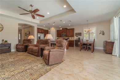 Stunning Golf & Lake Views | Oversized Saltwater Pool | on Herons Glen Golf and Country Club in Florida - for sale on GolfHomes.com, golf home, golf lot