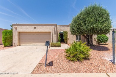 Tucked in a gated 55+ community along the OMNI Tucson National on Omni Tucson National Golf Resort and Spa - Catalina in Arizona - for sale on GolfHomes.com, golf home, golf lot