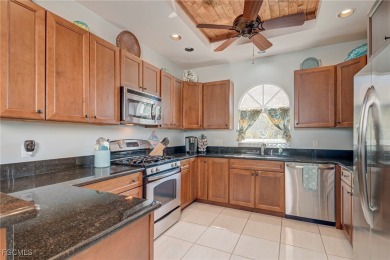 This charming, well-maintained, 3 bedroom/2 bath home, checks on Royal Tee Country Club in Florida - for sale on GolfHomes.com, golf home, golf lot