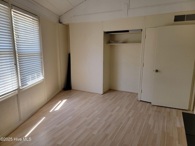 2 bedroom 2 bath waterfront home in Woodlake Country Club on Woodlake Country Club in North Carolina - for sale on GolfHomes.com, golf home, golf lot