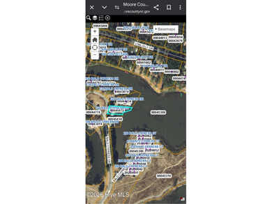 2 bedroom 2 bath waterfront home in Woodlake Country Club on Woodlake Country Club in North Carolina - for sale on GolfHomes.com, golf home, golf lot