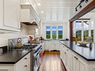 Classic in every sense of the word, this mountain chalet on Lake Toxaway Country Club in North Carolina - for sale on GolfHomes.com, golf home, golf lot