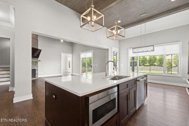 This craftsman style home features 4 bedrooms and 3.5 bathrooms on Tennessee National Golf Club in Tennessee - for sale on GolfHomes.com, golf home, golf lot