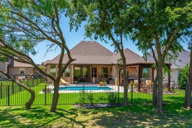 Discover your dream lifestyle with this pristine single-story on The Golf Club at Resort Eagle Mountain Lake in Texas - for sale on GolfHomes.com, golf home, golf lot