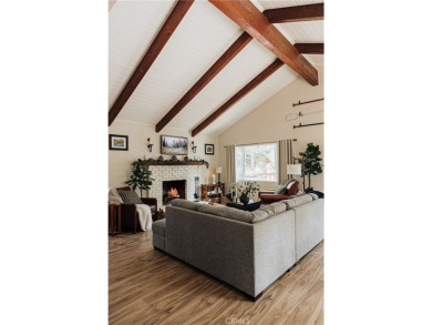 Escape to this stunning 4-bedroom, 3-bathroom mountain cabin on Lake Arrowhead Country Club in California - for sale on GolfHomes.com, golf home, golf lot