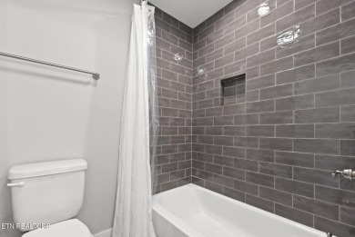 This craftsman style home features 4 bedrooms and 3.5 bathrooms on Tennessee National Golf Club in Tennessee - for sale on GolfHomes.com, golf home, golf lot