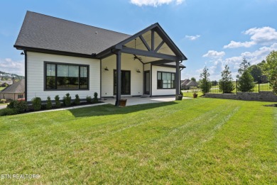 This craftsman style home features 4 bedrooms and 3.5 bathrooms on Tennessee National Golf Club in Tennessee - for sale on GolfHomes.com, golf home, golf lot