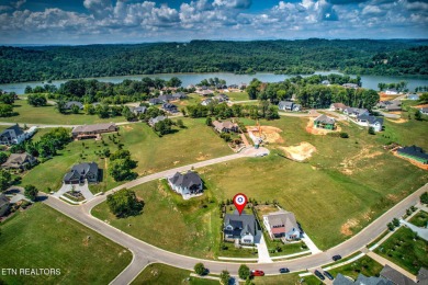 This craftsman style home features 4 bedrooms and 3.5 bathrooms on Tennessee National Golf Club in Tennessee - for sale on GolfHomes.com, golf home, golf lot