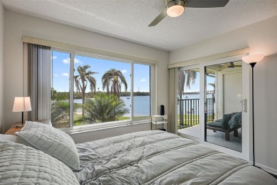 Beautiful water views abound from this 2nd floor villa in the on Isla Del Sol Yacht and Country Club in Florida - for sale on GolfHomes.com, golf home, golf lot