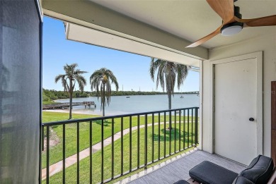 Beautiful water views abound from this 2nd floor villa in the on Isla Del Sol Yacht and Country Club in Florida - for sale on GolfHomes.com, golf home, golf lot
