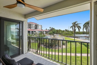 Beautiful water views abound from this 2nd floor villa in the on Isla Del Sol Yacht and Country Club in Florida - for sale on GolfHomes.com, golf home, golf lot