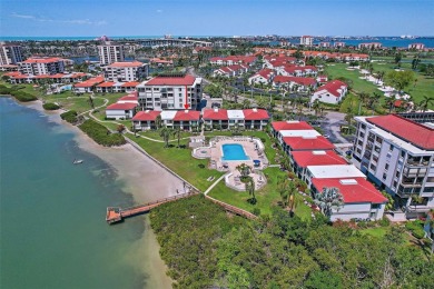 Beautiful water views abound from this 2nd floor villa in the on Isla Del Sol Yacht and Country Club in Florida - for sale on GolfHomes.com, golf home, golf lot