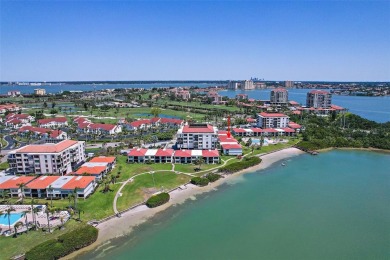 Beautiful water views abound from this 2nd floor villa in the on Isla Del Sol Yacht and Country Club in Florida - for sale on GolfHomes.com, golf home, golf lot