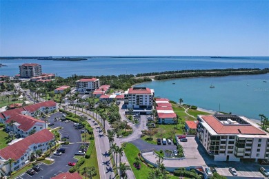 Beautiful water views abound from this 2nd floor villa in the on Isla Del Sol Yacht and Country Club in Florida - for sale on GolfHomes.com, golf home, golf lot