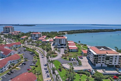 Beautiful water views abound from this 2nd floor villa in the on Isla Del Sol Yacht and Country Club in Florida - for sale on GolfHomes.com, golf home, golf lot
