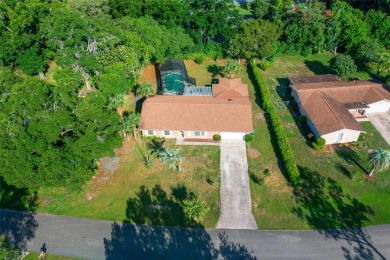 BIG AND BEAUTIFUL POOL HOME IN SILVER SPRING SHORES OCALA on Country Club At Silver Springs Shores in Florida - for sale on GolfHomes.com, golf home, golf lot