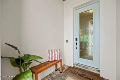 This stunning Hulbert Homes model in Veranda Bay isn't just on Ocean Palm Golf Course in Florida - for sale on GolfHomes.com, golf home, golf lot