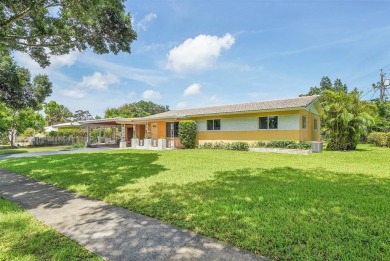 This charming 3-bedroom, 2-bathroom home offers the perfect on Fort Lauderdale Country Club in Florida - for sale on GolfHomes.com, golf home, golf lot