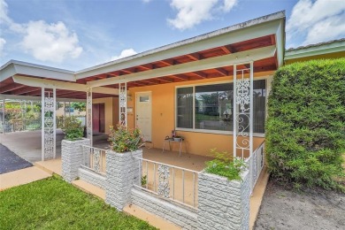 This charming 3-bedroom, 2-bathroom home offers the perfect on Fort Lauderdale Country Club in Florida - for sale on GolfHomes.com, golf home, golf lot